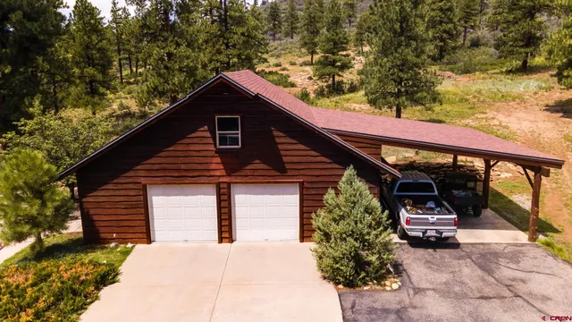 a house with trees in the background
