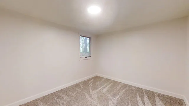 a bathroom with a tub sink and toilet
