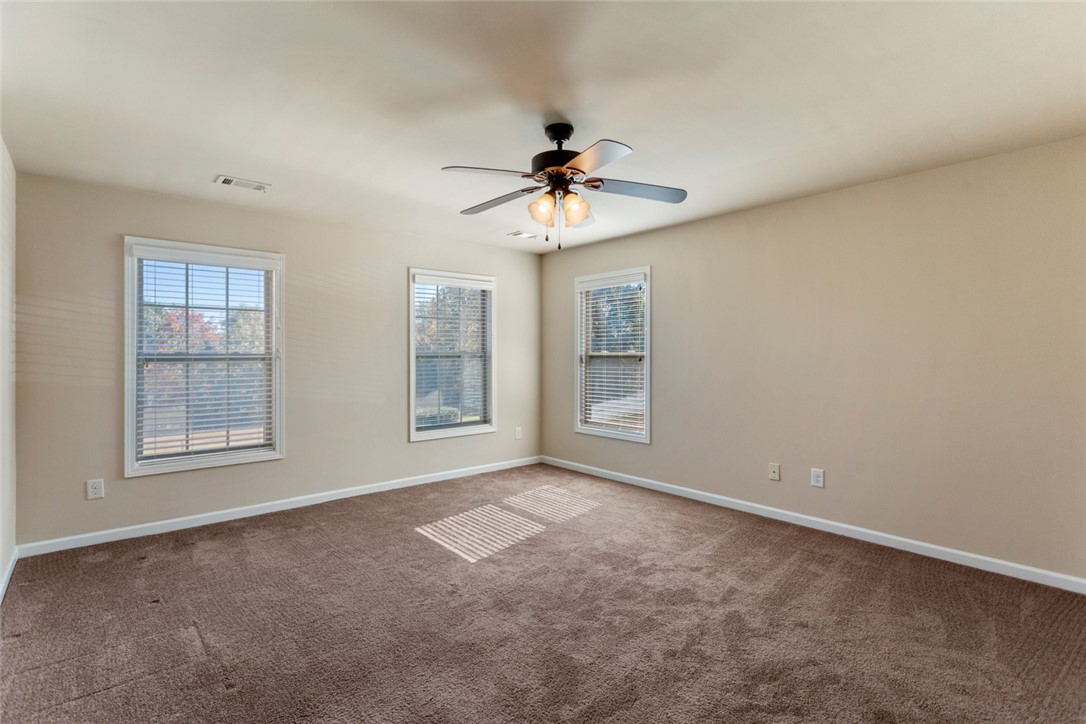 1005 Winmar Drive Anderson, SC 29621 - Photo 36 of 50 This spacious bedroom offers ample natural light and a comfortable ambiance for relaxation.