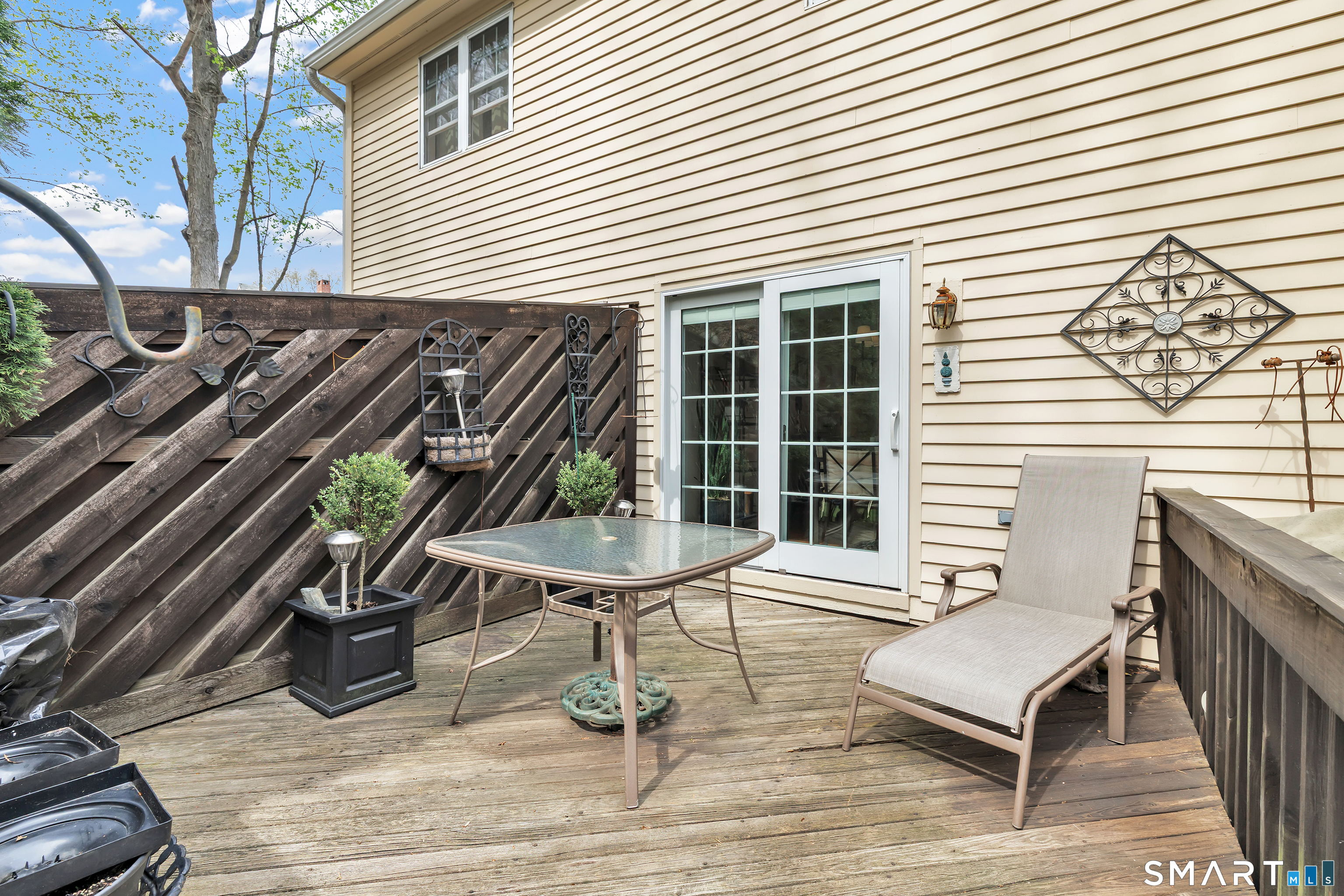 146 Howe Avenue, Unit 146 Shelton, CT 06484 - Photo 12 of 35 a view of a chairs and table in the balcony