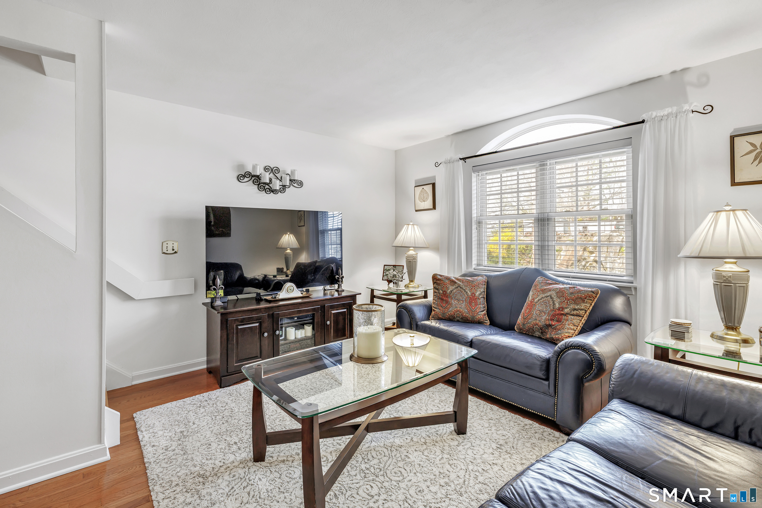 146 Howe Avenue, Unit 146 Shelton, CT 06484 - Photo 17 of 35 a living room with furniture a table and a large window