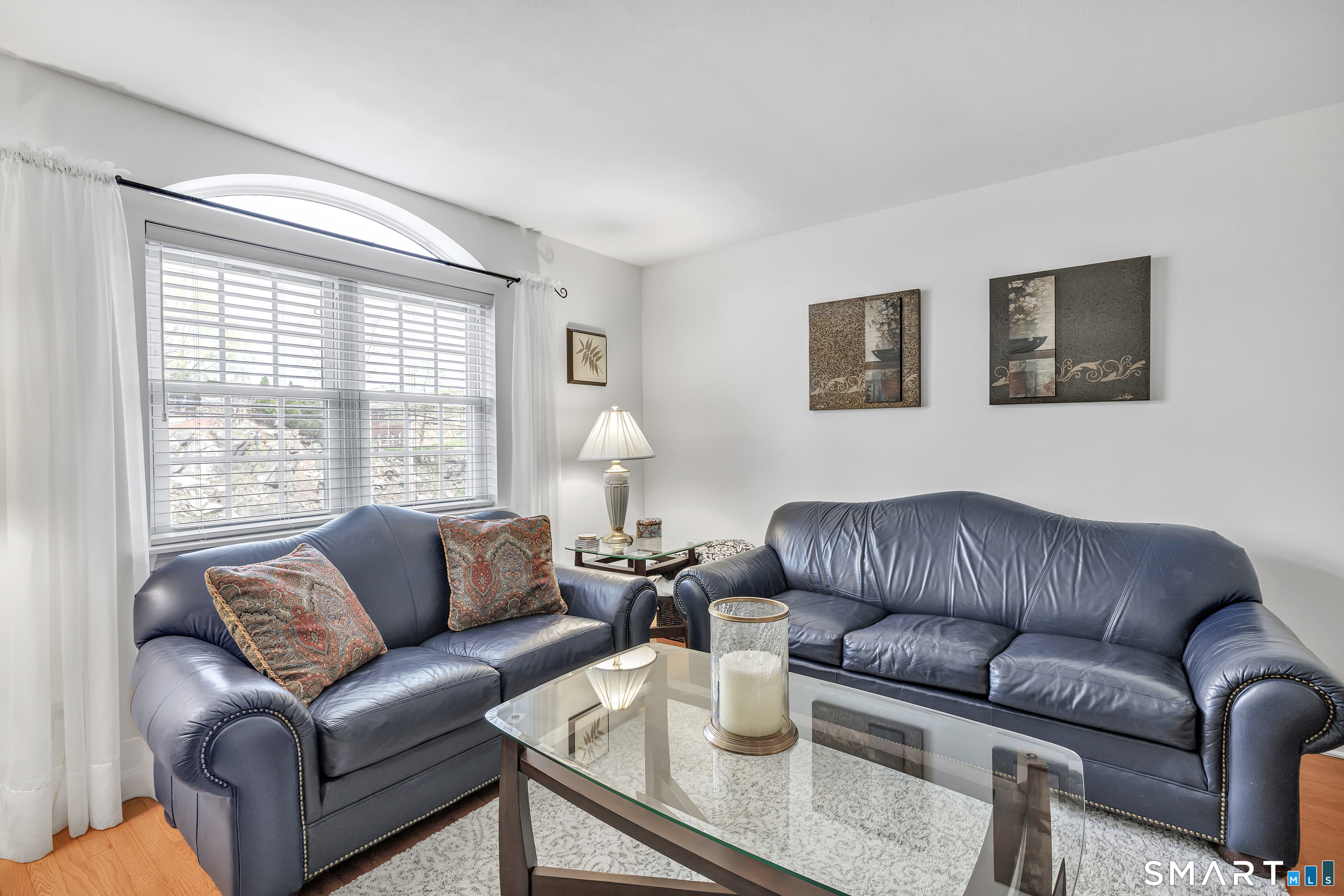 146 Howe Avenue, Unit 146 Shelton, CT 06484 - Photo 19 of 35 a living room with furniture and a couch