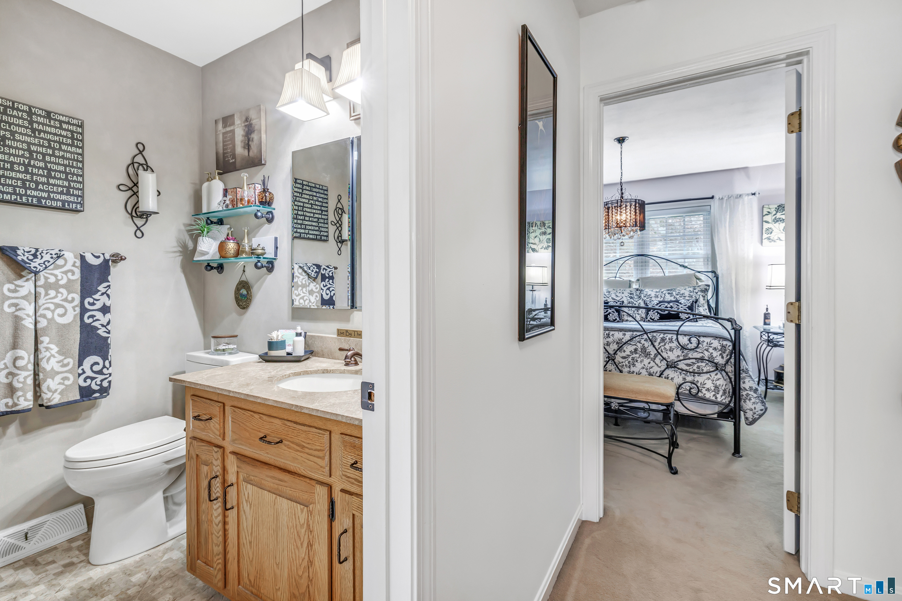 146 Howe Avenue, Unit 146 Shelton, CT 06484 - Photo 26 of 35 a en suite bathroom with a toilet sink and mirror