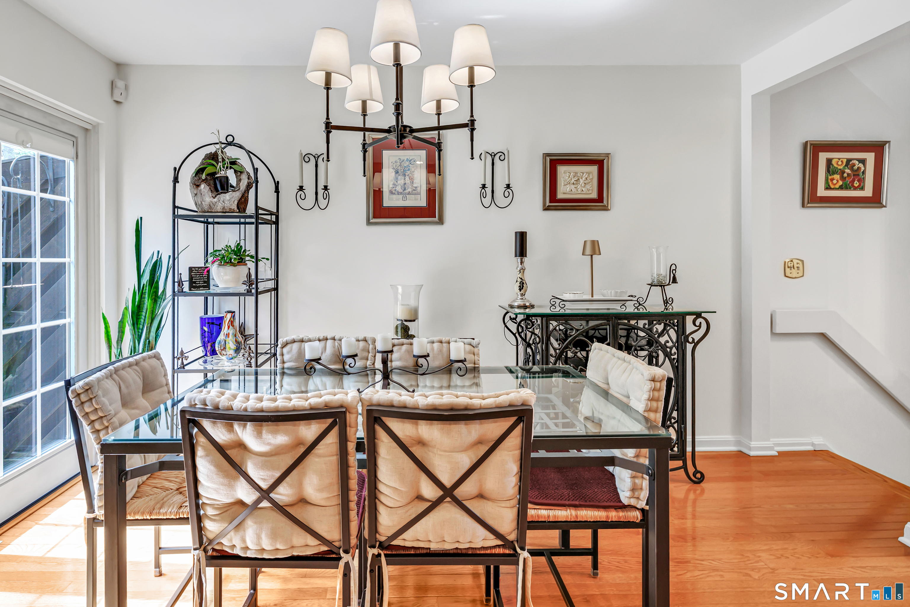 146 Howe Avenue, Unit 146 Shelton, CT 06484 - Photo 7 of 35 a view of a dining room with furniture wooden floor and a chandelier