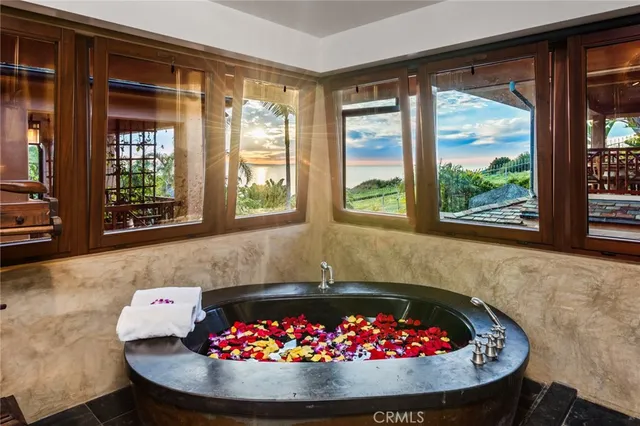 a living room filled with furniture and a floor to ceiling window