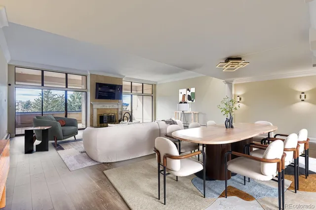 a living room with furniture dining table and a large window