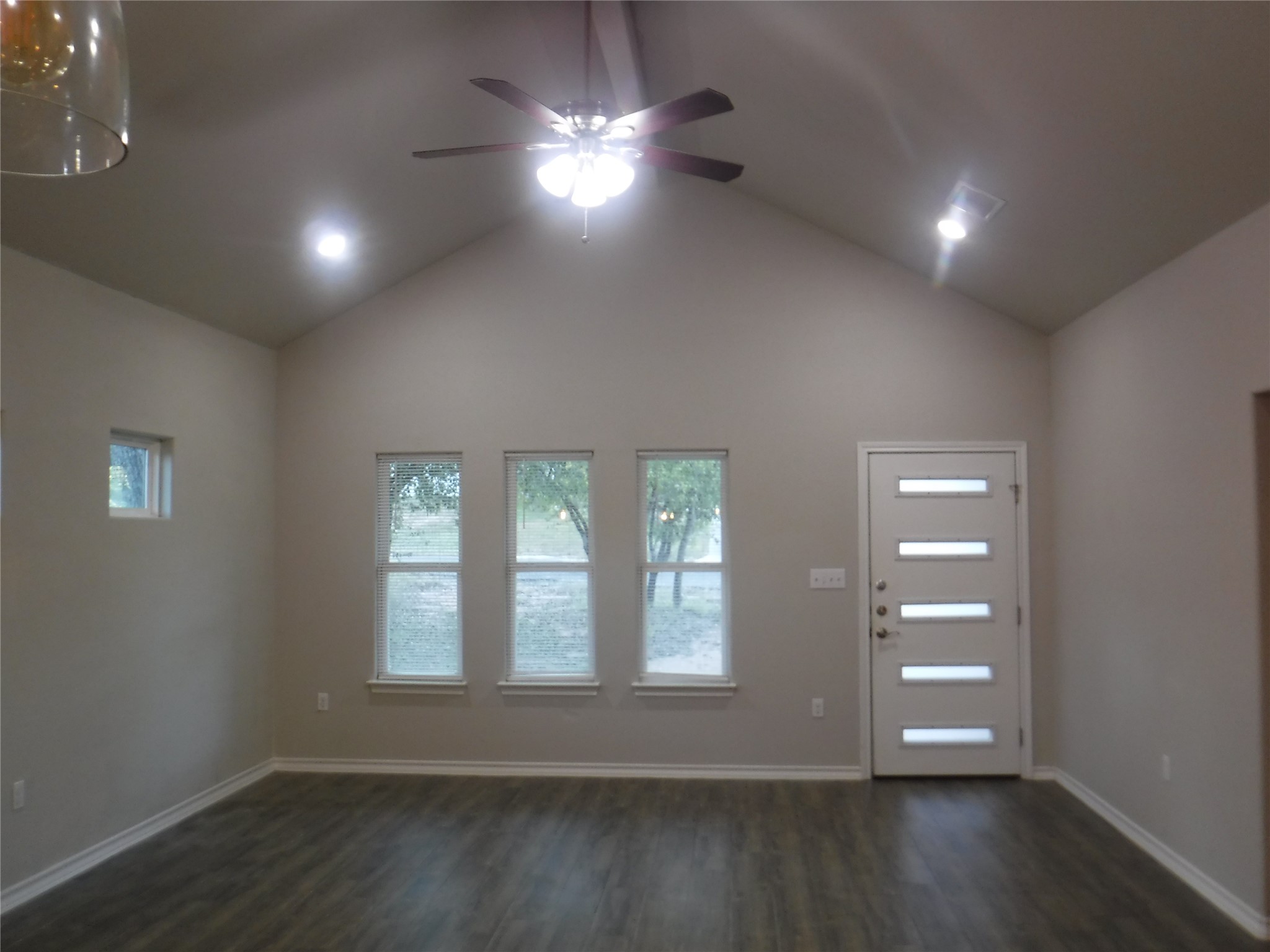 1633 Cree Trail Kingsland, TX 78639 - Photo 2 of 11 Entryway featuring dark wood-style floors, a ceiling fan, and high vaulted ceiling