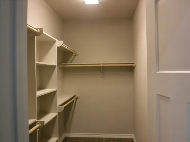 a view of an empty walk in closet