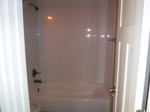 a bathroom with a toilet and a sink