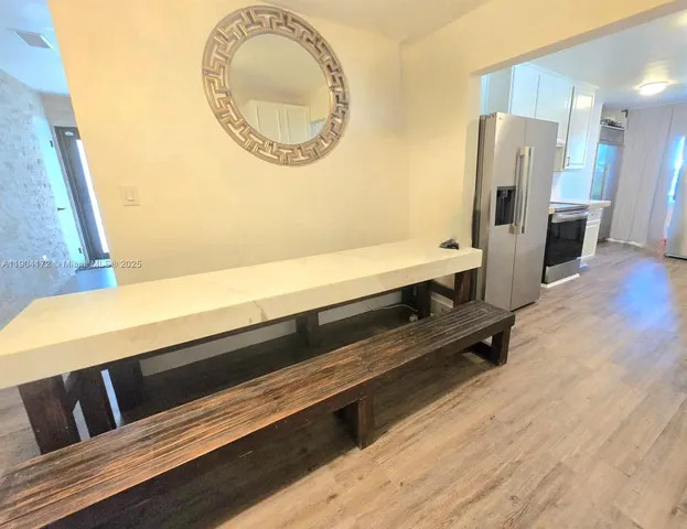 a view of kitchen and wooden floor