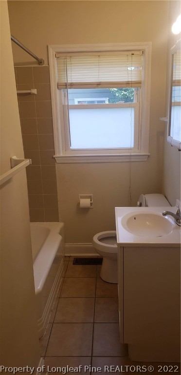 1203 Turnpike Road Fayetteville, NC 28305 - Photo 4 of 9 a bathroom with a sink a toilet and shower