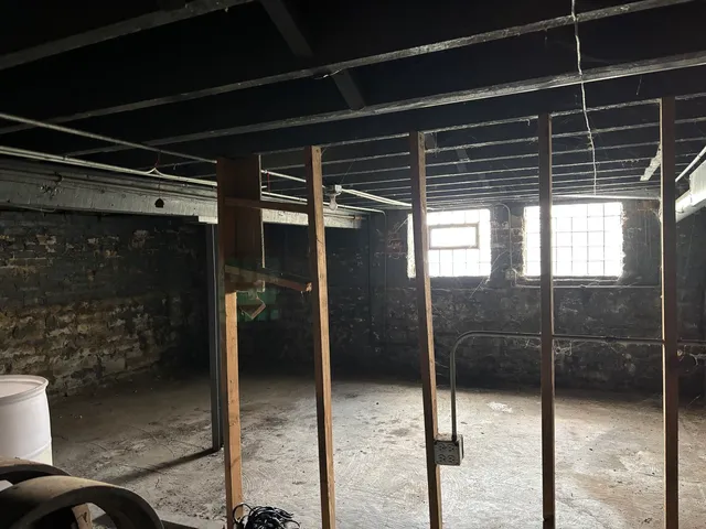 a view of walk in closet with clothes