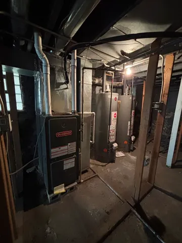 a view of a house with a yard and a floor to ceiling window