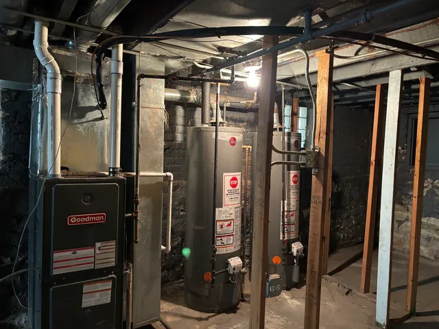 a view of a house with a yard and a floor to ceiling window