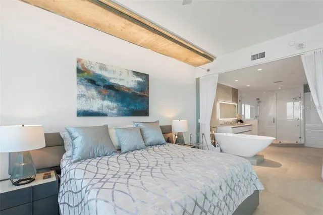 a workspace with furniture and large window