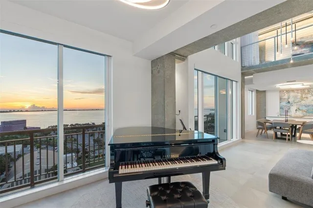 a view of a swimming pool with outdoor seating