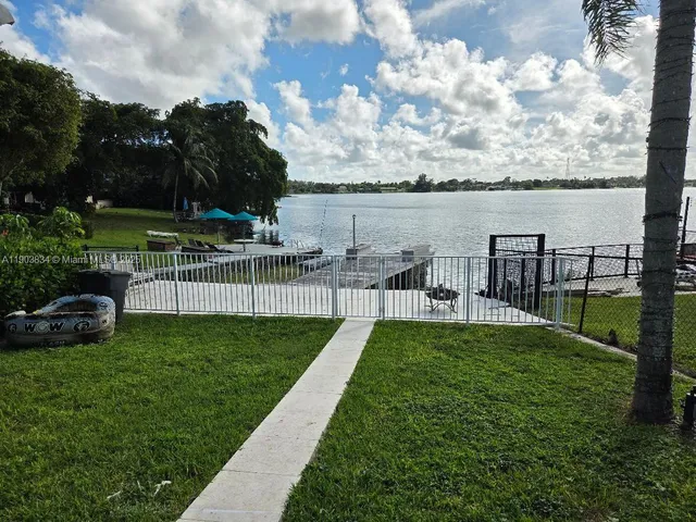 a view of a garden with houses