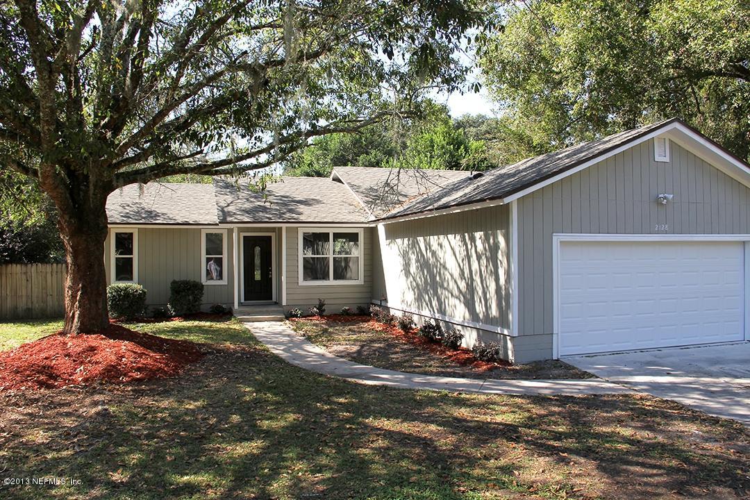 2128 Blair Road Jacksonville, FL 32221 - Photo 1 of 11 a front view of a house with a yard and outdoor seating