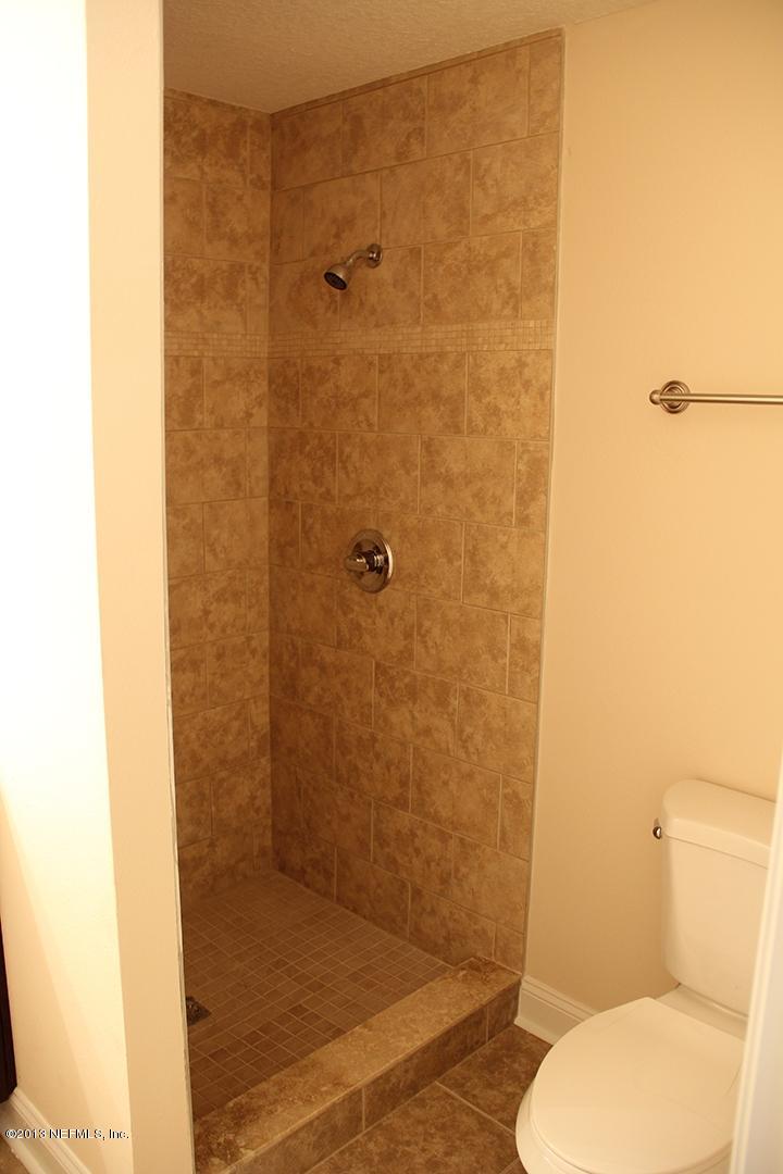2128 Blair Road Jacksonville, FL 32221 - Photo 11 of 11 a bathroom with a toilet and a shower