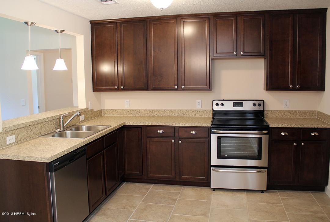 2128 Blair Road Jacksonville, FL 32221 - Photo 5 of 11 a kitchen with a sink and a stove