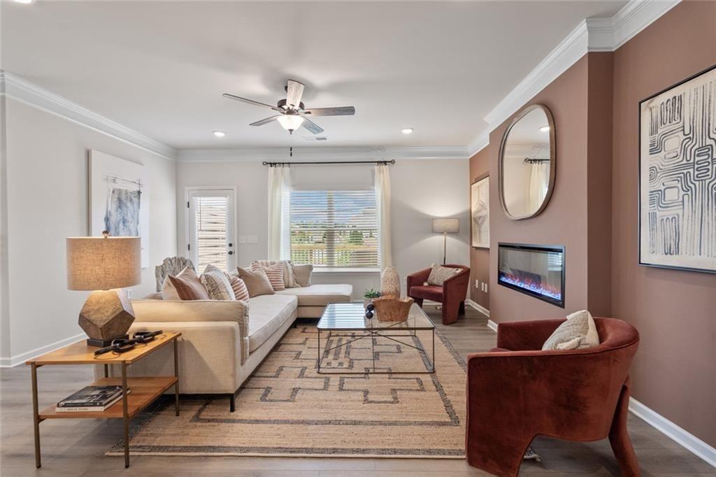 235 Bastian Drive, Unit 17 Villa Rica, GA 30180 - Photo 4 of 30 a living room with furniture chandelier and a window