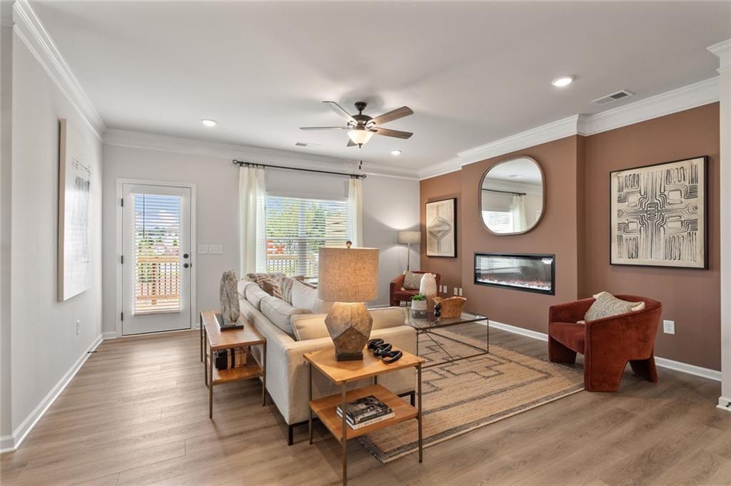 235 Bastian Drive, Unit 17 Villa Rica, GA 30180 - Photo 5 of 30 a living room with furniture a fireplace and a window