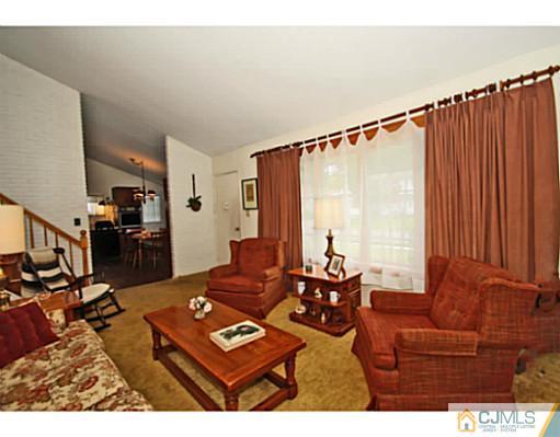 78 Westminster Road Colonia, NJ 07067 - Photo 14 of 25 a living room with furniture window and wooden floor