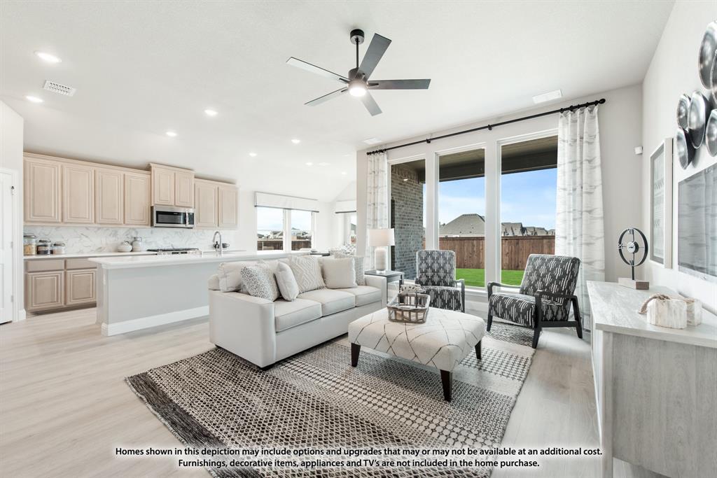 1152 Hitching Post Way Oak Point, TX 75068 - Photo 13 of 36 a living room with furniture appliances and a large window