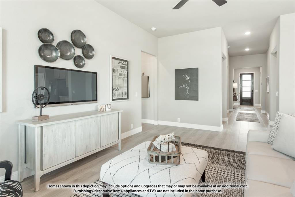 1152 Hitching Post Way Oak Point, TX 75068 - Photo 17 of 36 a living room with furniture and a flat screen tv