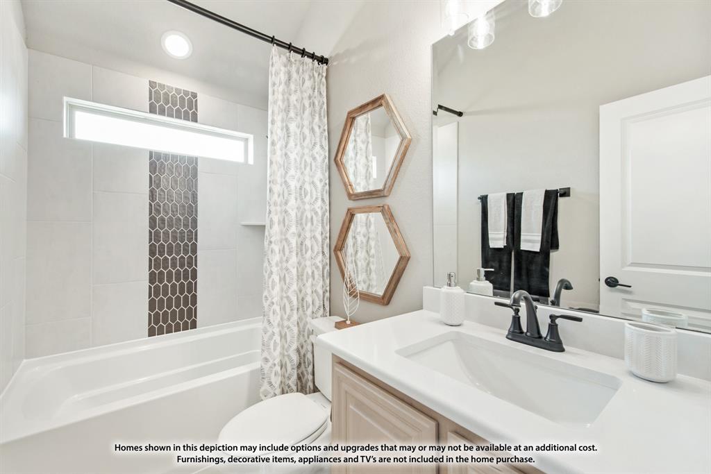 1152 Hitching Post Way Oak Point, TX 75068 - Photo 8 of 36 a bathroom with a sink a toilet and a mirror