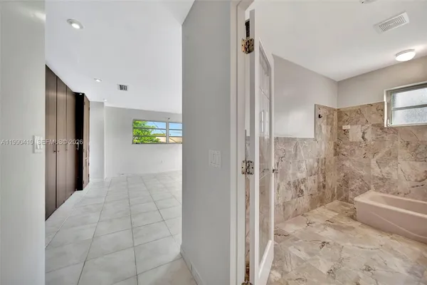 a view of a yard with a house in the background