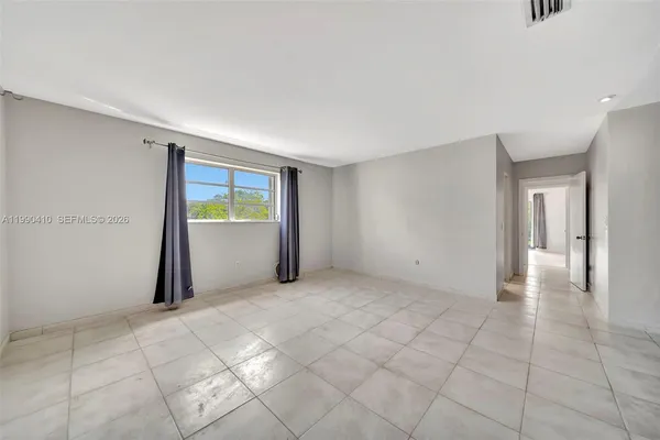 an aerial view of a house with outdoor space and lake view