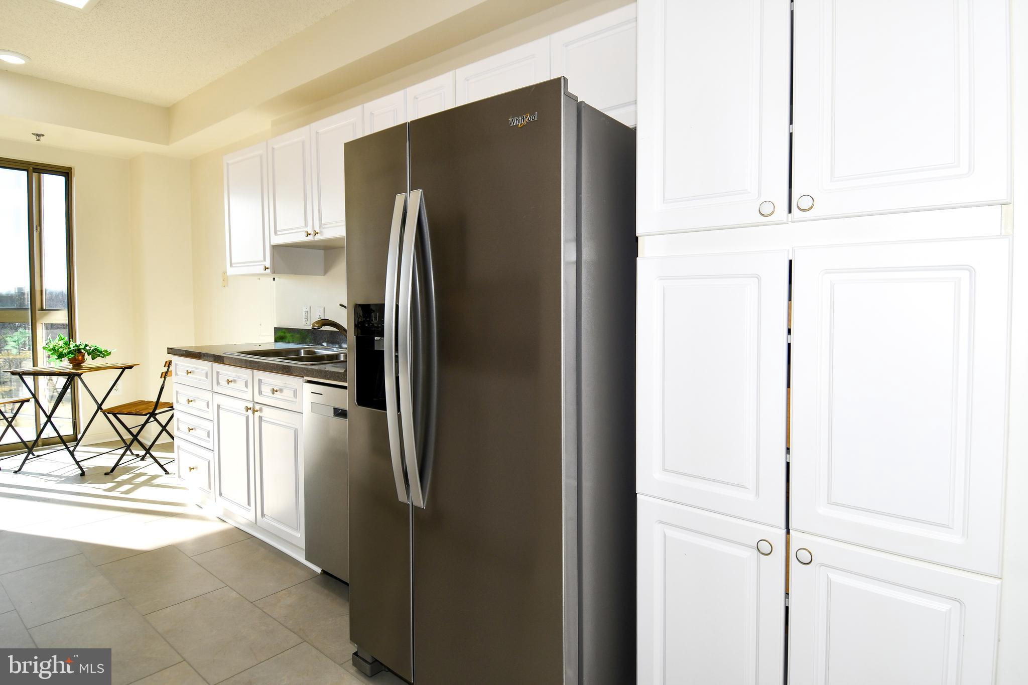 3100 North Leisure World Boulevard, Unit 801 Silver Spring, MD 20906 - Photo 24 of 69 a kitchen with stainless steel appliances granite countertop a refrigerator and a stove