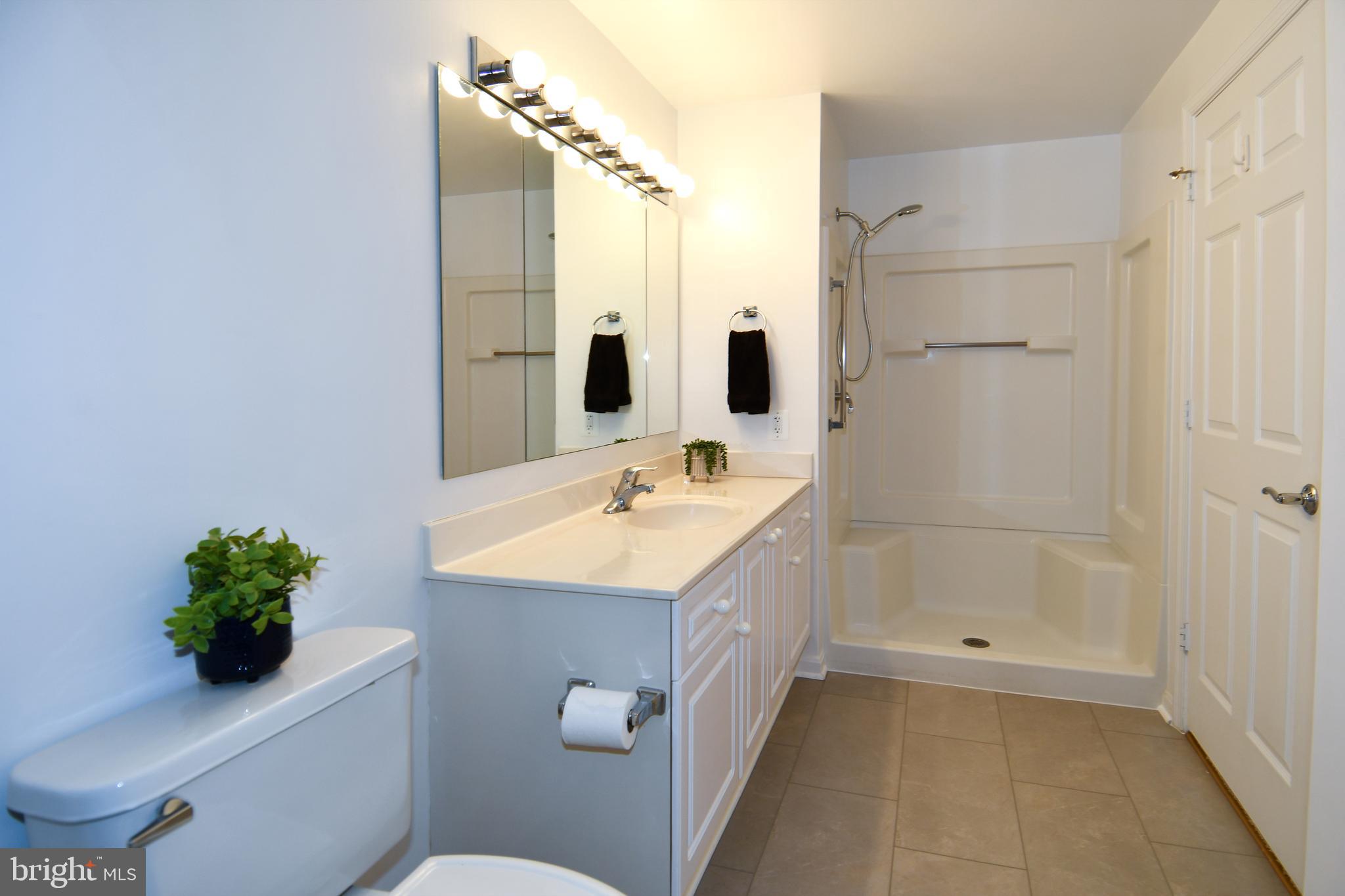 3100 North Leisure World Boulevard, Unit 801 Silver Spring, MD 20906 - Photo 35 of 69 a bathroom with a sink toilet and shower