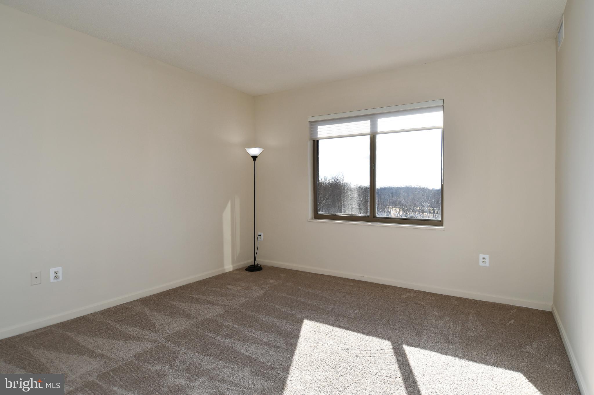 3100 North Leisure World Boulevard, Unit 801 Silver Spring, MD 20906 - Photo 46 of 69 a view of an empty room with a window