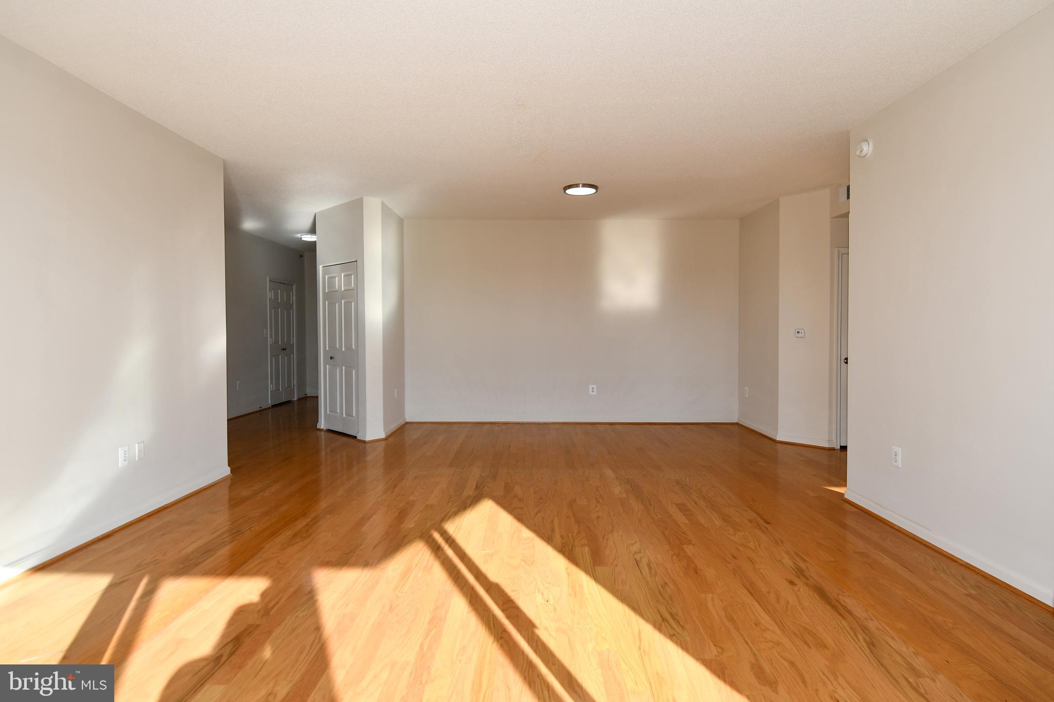 3100 North Leisure World Boulevard, Unit 801 Silver Spring, MD 20906 - Photo 7 of 69 a view of an empty room and wooden floor