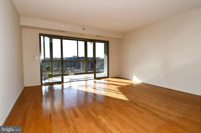 a kitchen with stainless steel appliances granite countertop a refrigerator and a stove