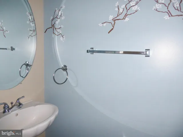 a bathroom with a sink and mirror