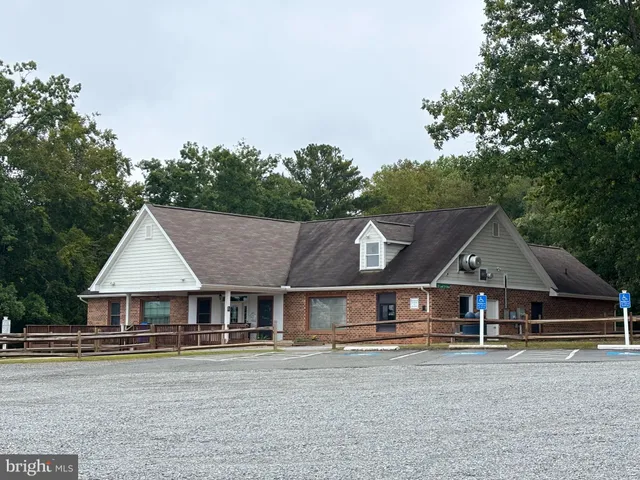 a house with trees in the background