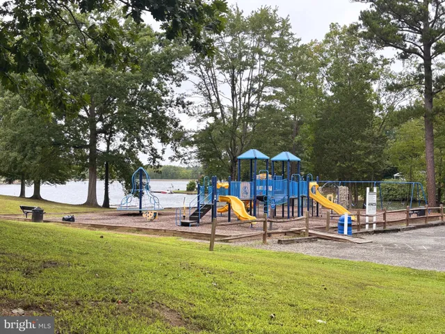 a view of a park with swings and slides