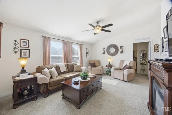 a living room with furniture and a large window