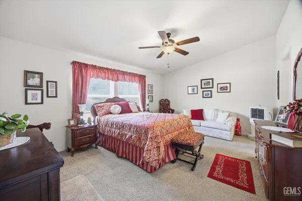 a bed room with a bed and a couch