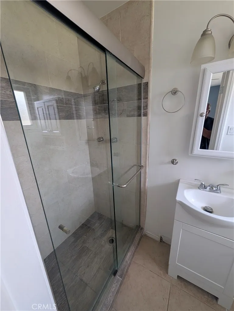 8641 Garfield Street, Unit 1 Riverside, CA 92504 - Photo 14 of 19 a bathroom with a sink and mirror