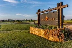 a view of a park with an ocean view