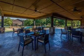 a outdoor dining space with furniture and outdoor view
