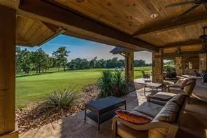 a view of a patio with swimming pool table and chairs