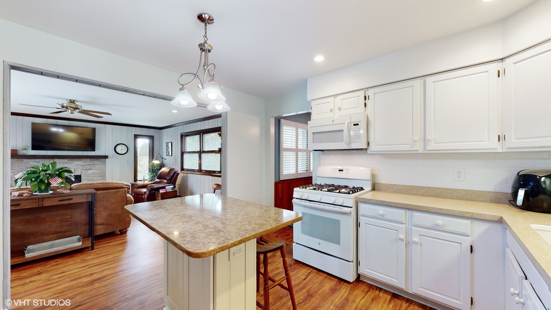 48 Lloyd Street Cary, IL 60013 - Photo 11 of 62 a kitchen that has a lot of white cabinets and stainless steel appliances
