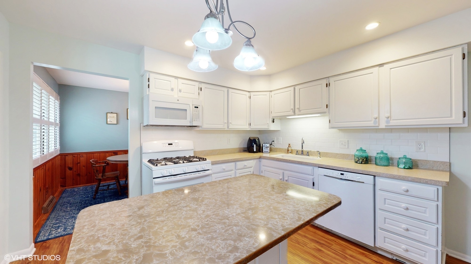 48 Lloyd Street Cary, IL 60013 - Photo 13 of 62 a kitchen with stainless steel appliances granite countertop a sink and cabinets