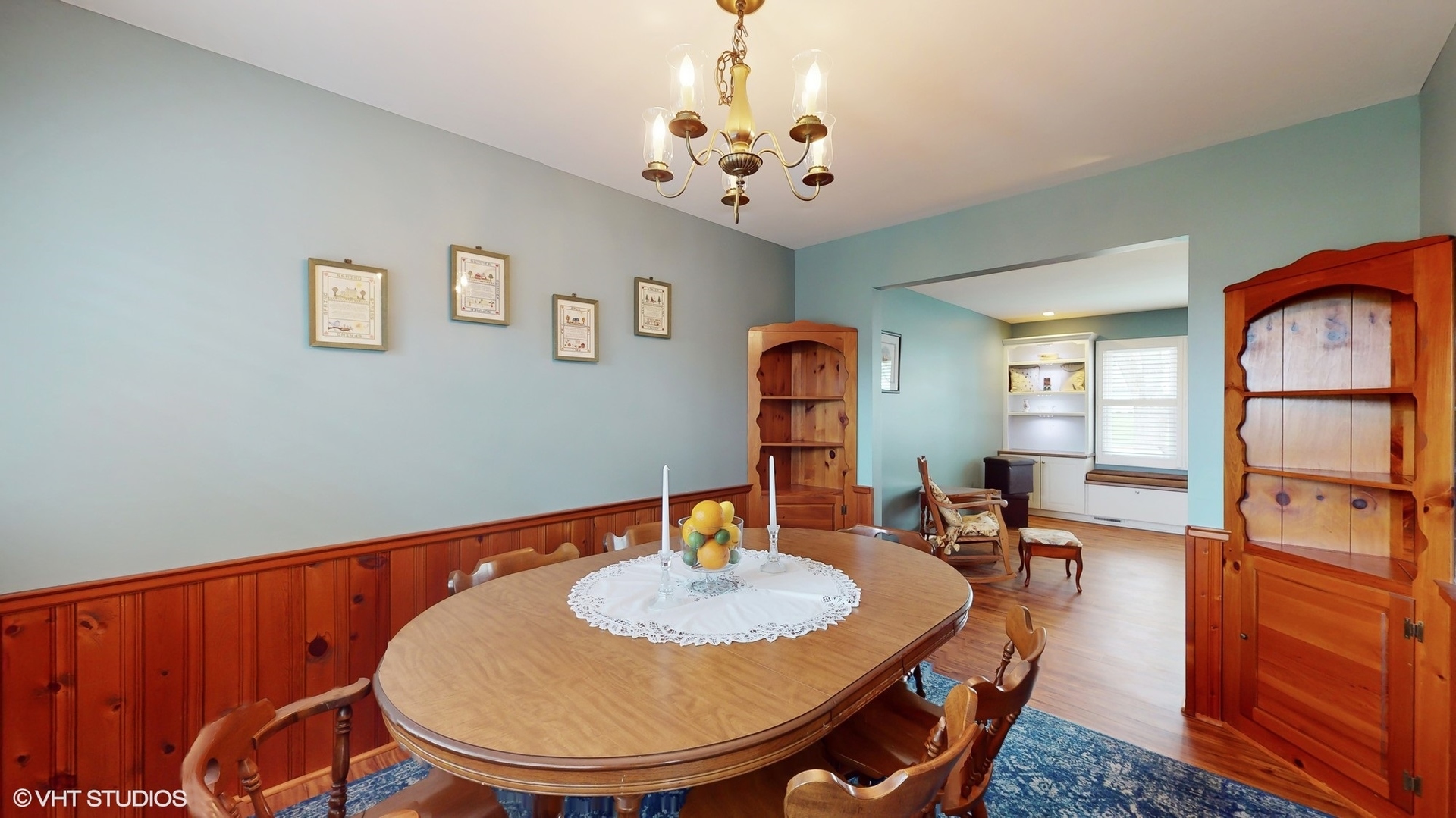 48 Lloyd Street Cary, IL 60013 - Photo 17 of 62 a view of a dining room with furniture a chandelier and wooden floor