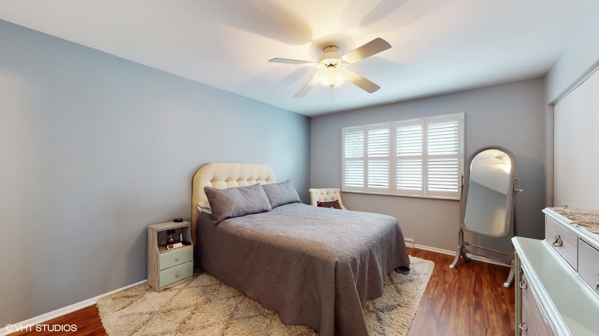 48 Lloyd Street Cary, IL 60013 - Photo 25 of 62 a bedroom with a bed and a chandelier